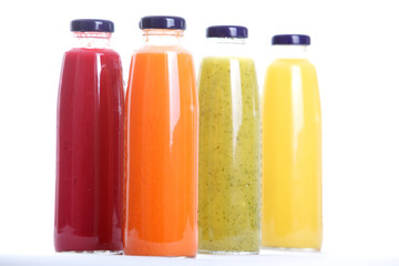Bottles of fruit juice isolated on white background