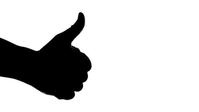 Silhouette of hand giving thumb up on white background.