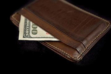 wallet with hundred dollars