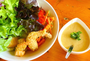 Salad greens adds the shrimp fries.