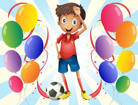 A soccer player in the middle of the balloons