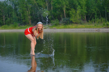 Fototapeta premium girl standing in a river