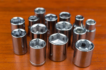 Set of chromeplated wrench dadoes, on wood