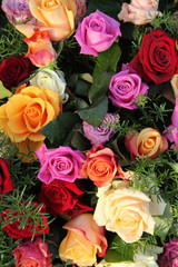 Multicolored roses in flower arrangement