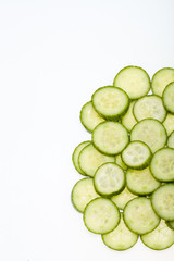 Freshly sliced cucumber  isolated on white background