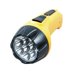 Yellow electric pocket flashlight isolated on white.