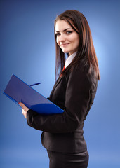 Closeup pose of young businesswoman holding a notebook