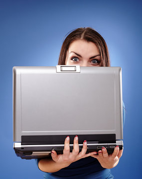 Young Woman Hiding Behind Her Laptop