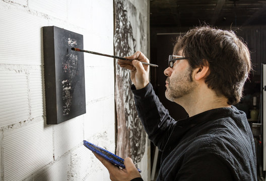 Painter Artist Working On A Oil Canvas