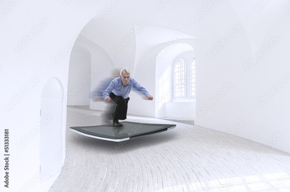 Wall mural senior businessman surfing on a tablet