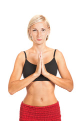 Fototapeta premium Practicing Yoga. Young woman isolated on white background