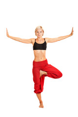 Practicing Yoga. Young woman isolated on white background