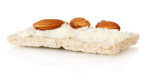 Crispbread with milk cheese and almond, isolated on white