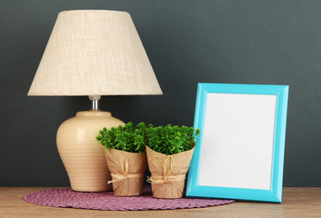 Colorful photo frame, lamp and flowers