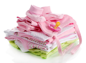 Pile of baby clothes isolated on white