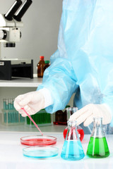 Scientist conducting research in laboratory close up