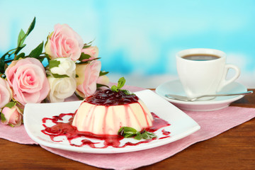 Panna Cotta with raspberry sauce, on bright background