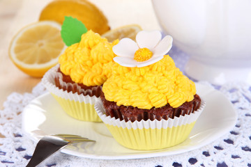 Beautiful lemon cupcakes on dining table close-up