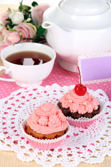 Beautiful strawberry cupcakes and flavored tea