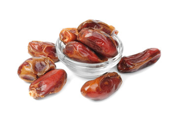 dried dates on glass bowl isolated on white background