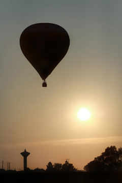 Hot air balloon take-off in sunrise