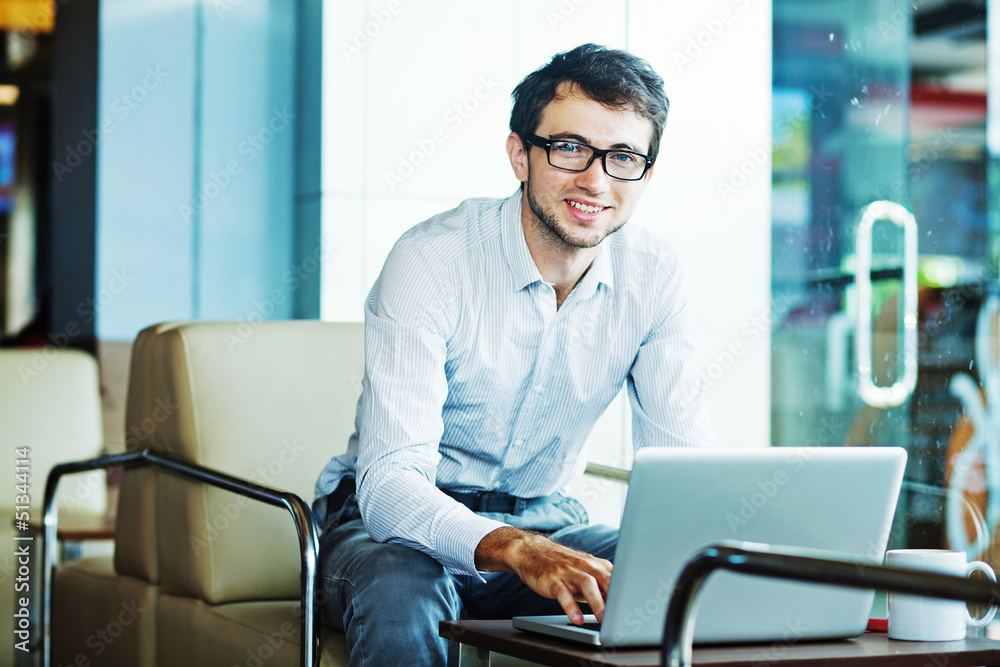 Wall mural businessman sitting in cafe