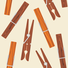 Wooden clothespins on the beige background