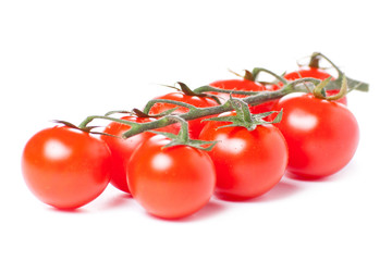 Juicy organic Cherry tomatoes isolated over white background