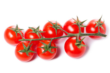 Juicy organic Cherry tomatoes isolated over white background