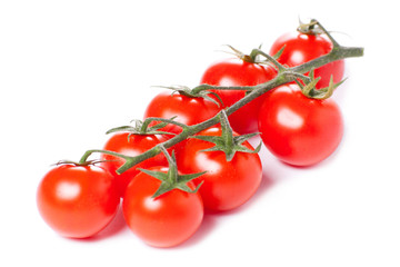 Juicy organic Cherry tomatoes isolated over white background