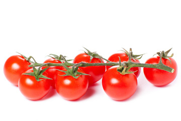Juicy organic Cherry tomatoes isolated over white background