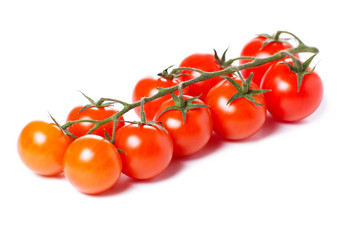 Juicy organic Cherry tomatoes isolated over white background