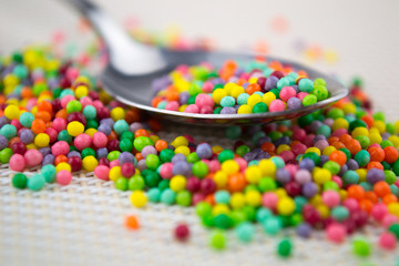 colorful sugar sprinkles in spoon