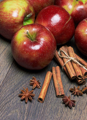 Fresh red apples with cinnamon and anise