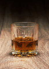 whiskey in glasses on wooden
