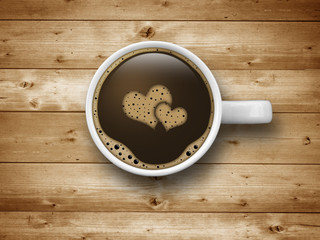 Kaffeetasse mit Herz auf Holz