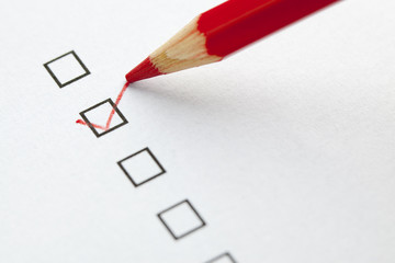 Red pencil selecting a empty check box