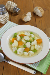 Vegetable soup with cauliflower and green peas