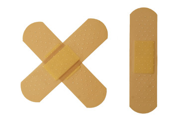 Crossed and single bandages on white background