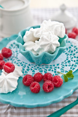 Fresh raspberries and sweet meringues