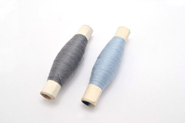 two spool of thread on a white background