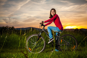 Fototapeta na wymiar Girl biking