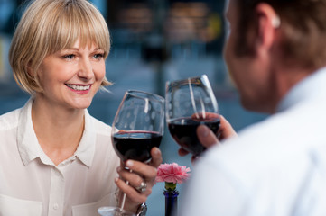 Couple toasting in a restaurant