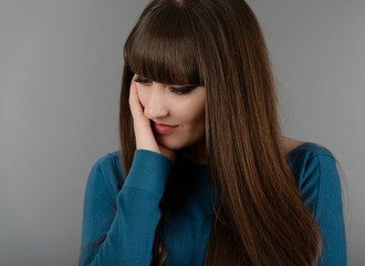 portrait of a beautiful woman thinking about something isolated