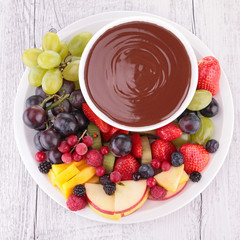 chocolate sauce and assorted of fruits