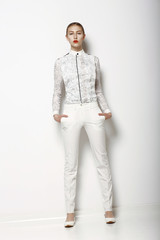Fototapeta na wymiar High Fashion. Trendy Woman in White Breeches. Spring Collection