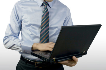Businessman typing on a Personal Computer keyboard