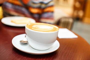 Coffee cup with a drawing on it