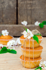 Muffins with filling on the wooden table