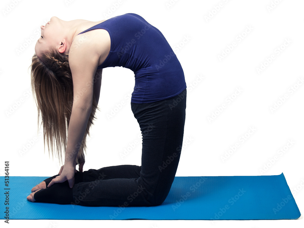 Wall mural young woman yoga exercise the camel - isolated